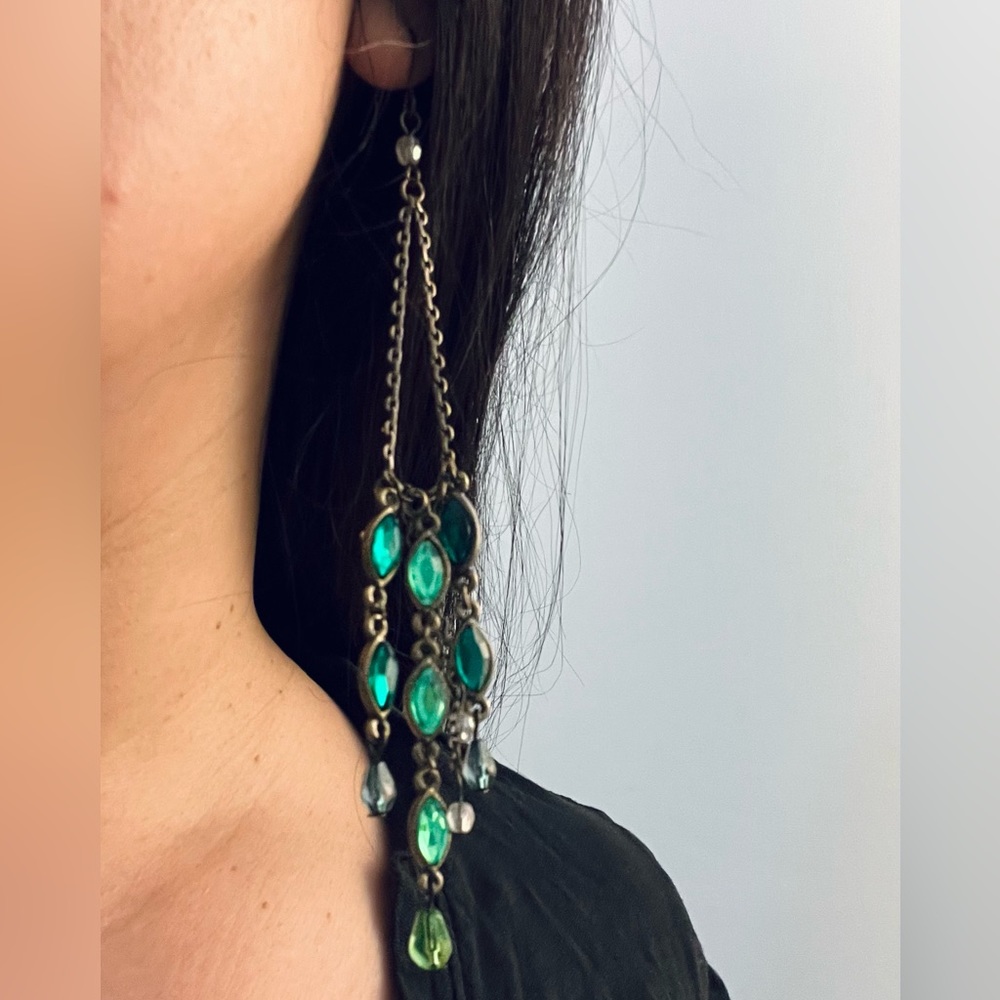 Beautiful long chandelier earrings with green glass.